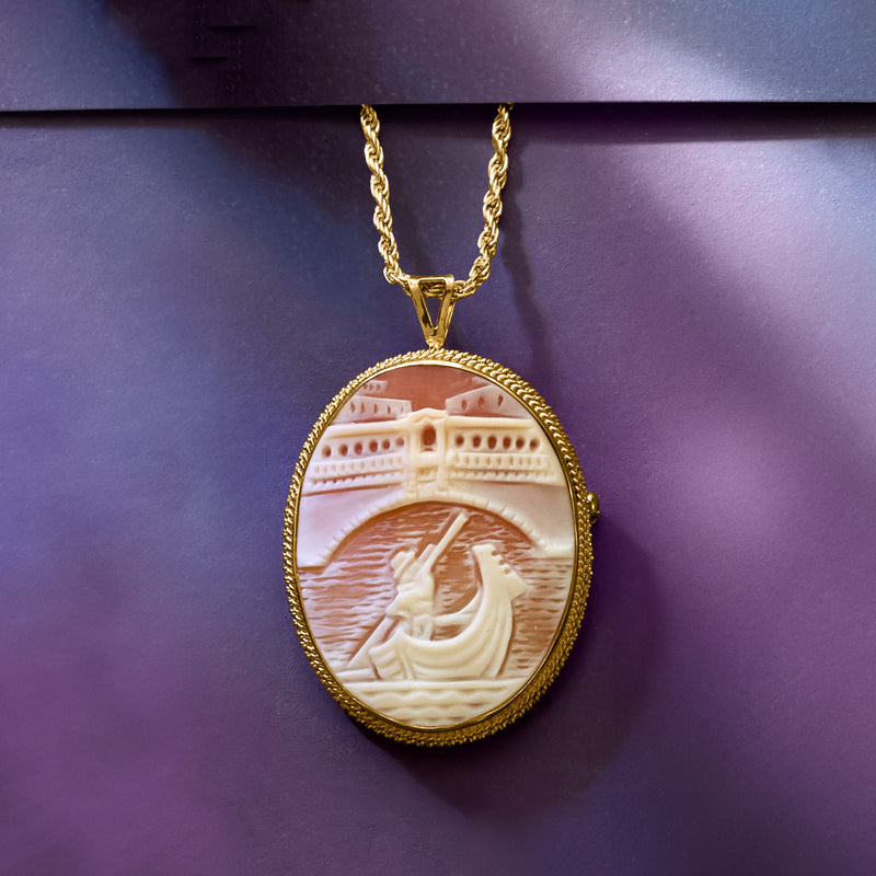 Gold chain oval cameo pendant with orange shell portrait, textured gold bezel