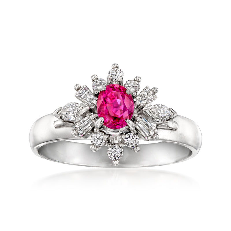 Platinum ruby and diamond halo ring with round magenta center stone and petal diamonds