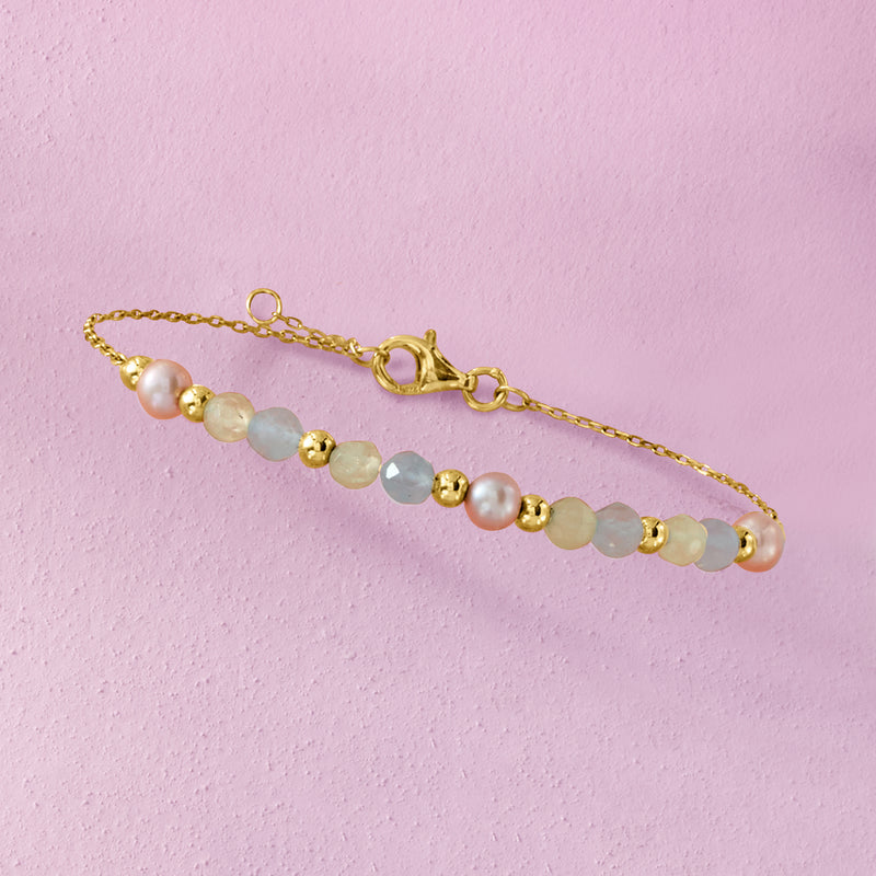 Gold beaded bracelet with light blue and pale pink beads and small gold clasp details