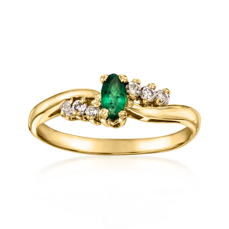 14kt yellow gold ring with emerald center and diamond cluster accents