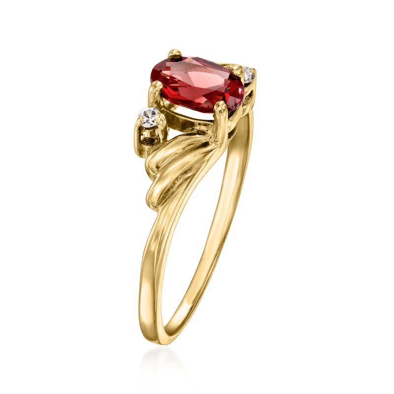 14kt yellow gold ring with large oval red garnet and side diamond clusters