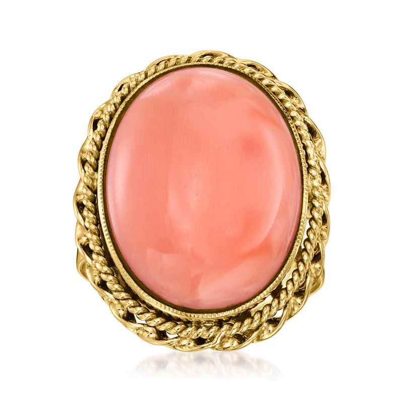 Vintage coral oval ring in 14kt yellow gold with braided bezel border