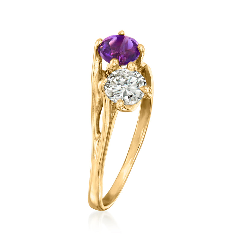 14kt yellow gold ring with purple oval amethyst above round diamond in claw setting