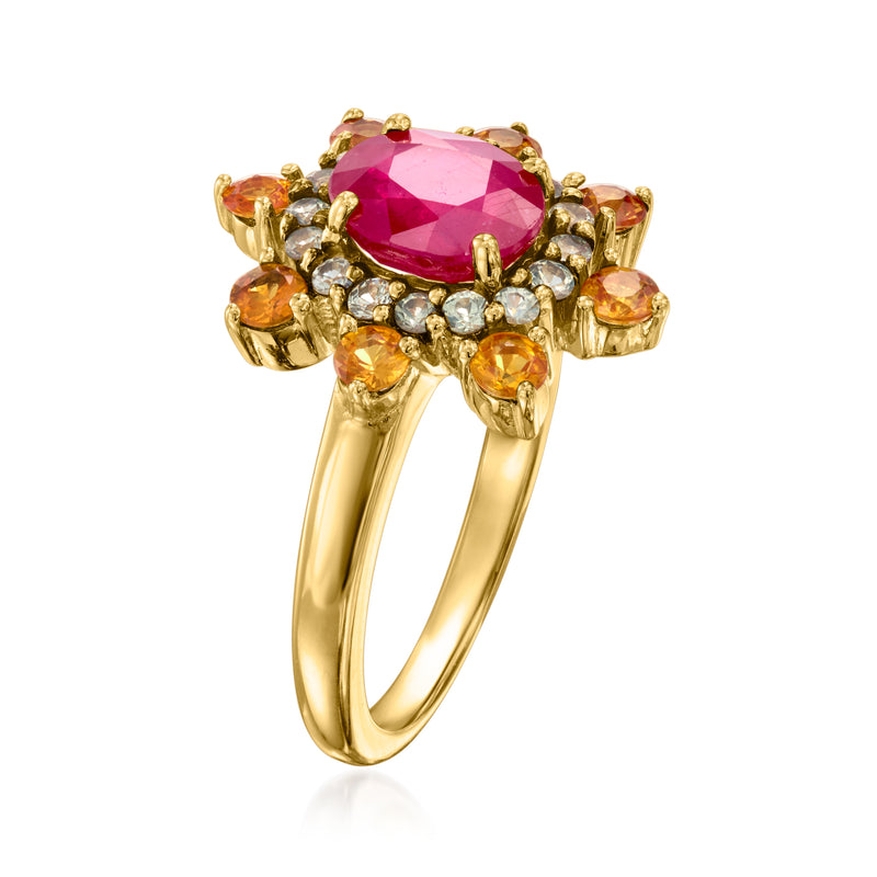 Yellow gold ring with marquise pink ruby centerpiece, orange side stones, and white accents