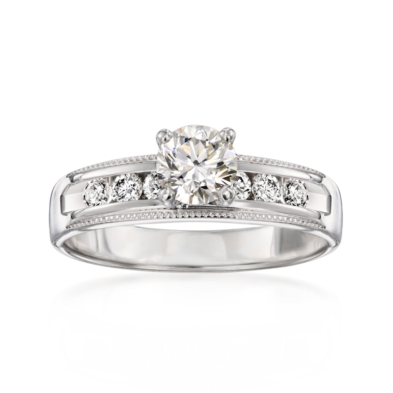 White gold diamond ring with round center stone and side baguette diamonds