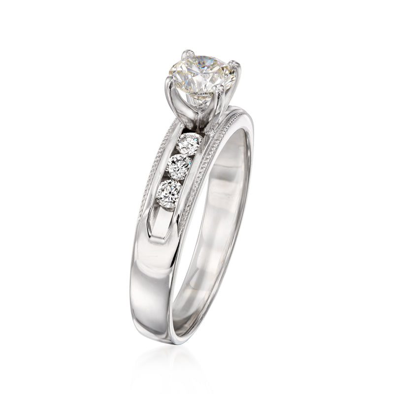 White gold diamond ring with large center diamond and channel-set side stones