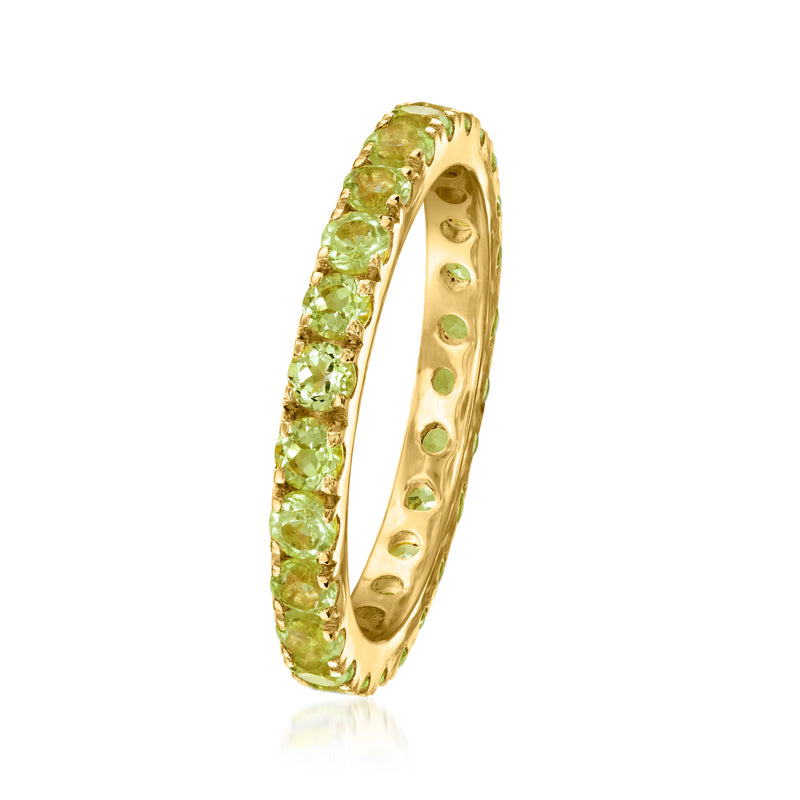 Peridot eternity band with channel-set green gemstones and gold over sterling band