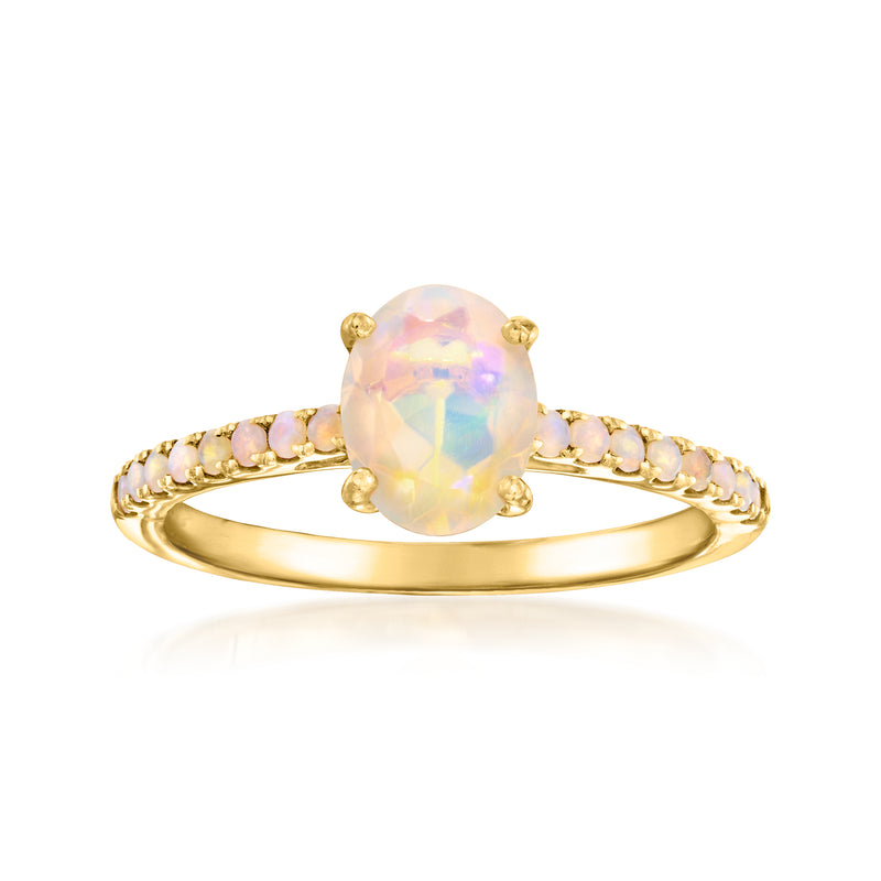 Opal birthstone ring in gold-tone setting with oval opal center and prong details