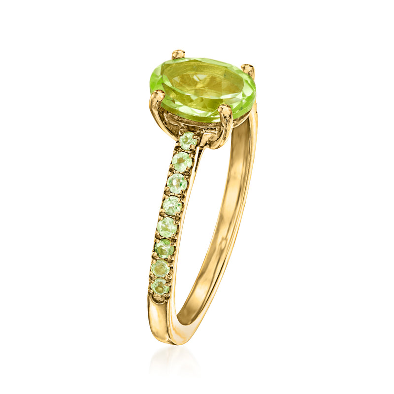 Gold over sterling ring with large oval green peridot and green gemstone halo