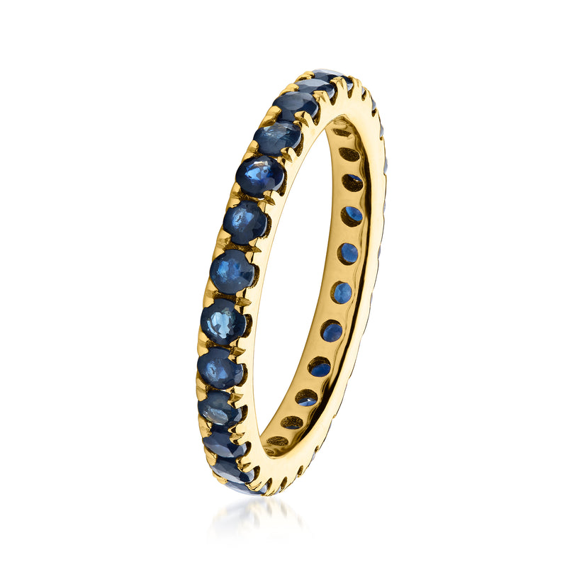 18kt gold over sterling eternity band side view with dark blue round sapphire stones