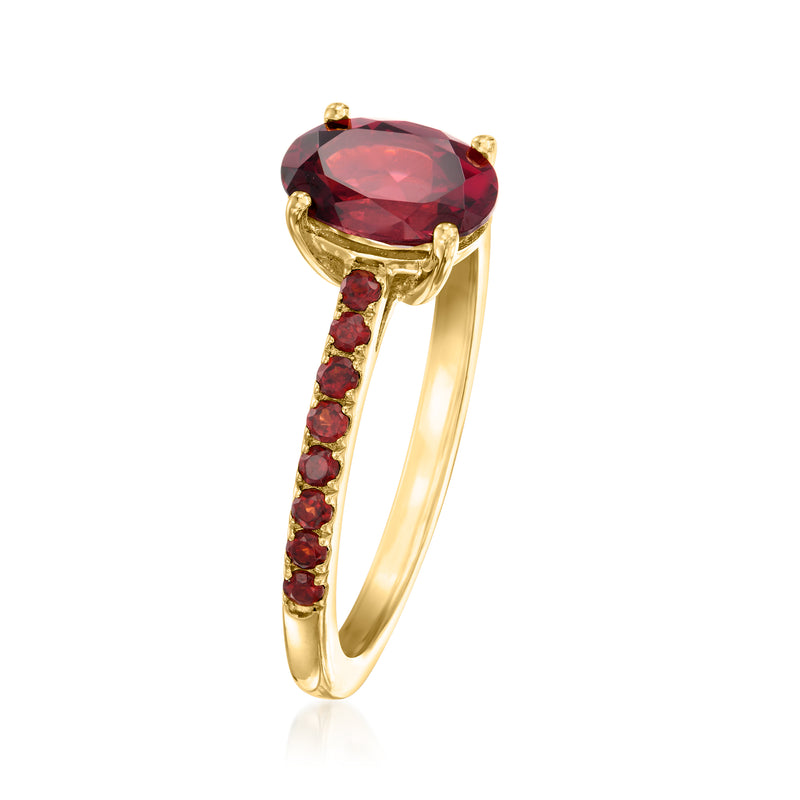 Gold oval red garnet ring with red stone accents on slim curved band