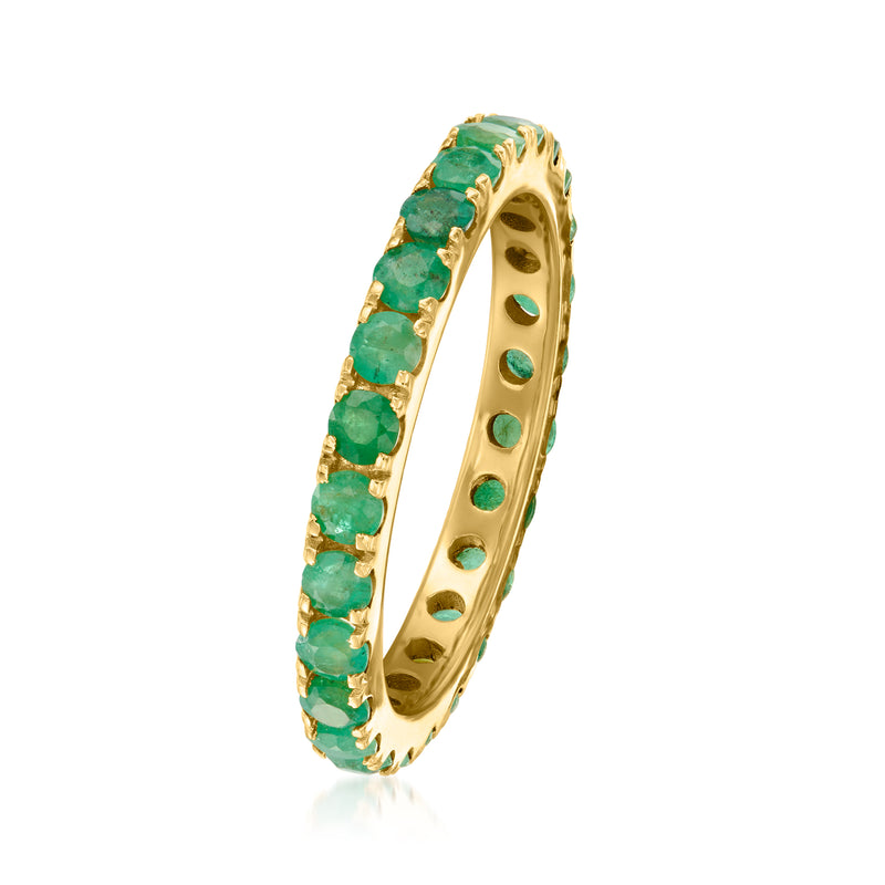 Side view emerald eternity band in gold with green stones along the curved setting