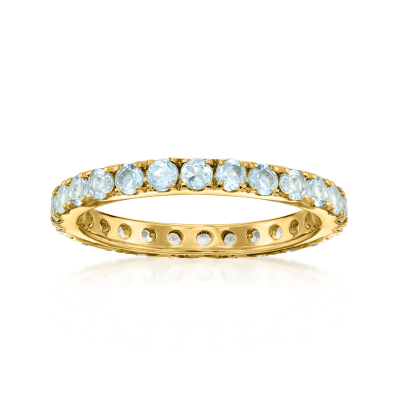 Gold over sterling eternity band with light blue aquamarine round stones