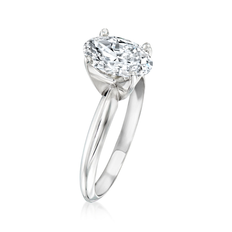 14kt white gold solitaire ring with round diamond center, side view