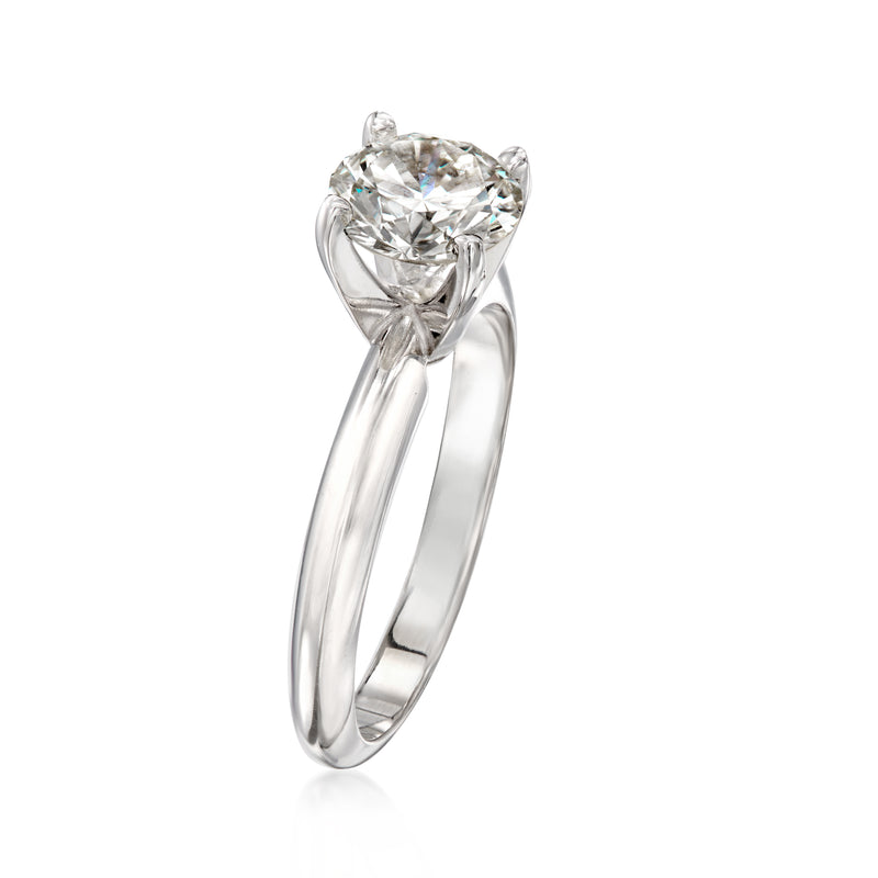 14kt white gold solitaire diamond ring, side view of round center stone prongs