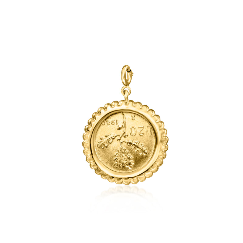 Gold-tone beaded-edge coin charm with profile relief and top loop