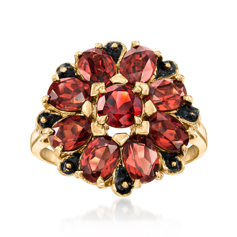 Vintage cluster ring in 10kt yellow gold with red garnet gemstones and dark accent stones