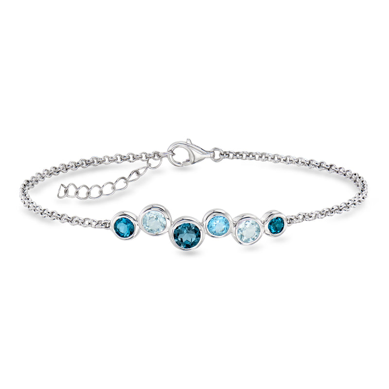 Sterling silver bubble bracelet with round tonal blue topaz stones in a row