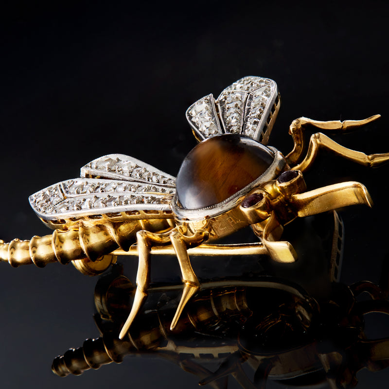 Dragonfly pin with tiger's eye body, diamond wings, and gold legs
