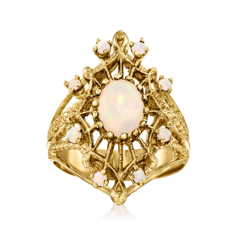 Vintage yellow gold opal ring, oval center with openwork prongs, small opal accents