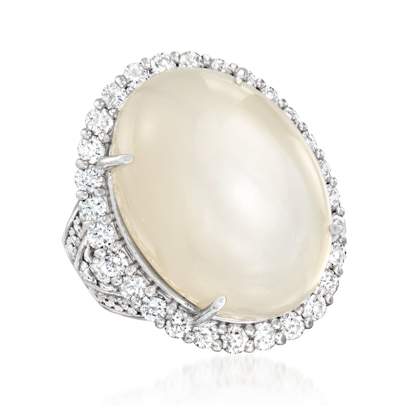 Oval moonstone cabochon ring in platinum with round diamond halo, side angle