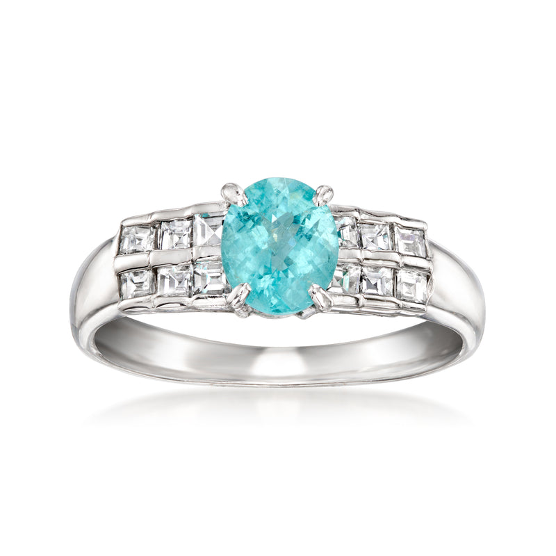 Platinum ring with oval paraiba-blue tourmaline center and baguette diamond side settings
