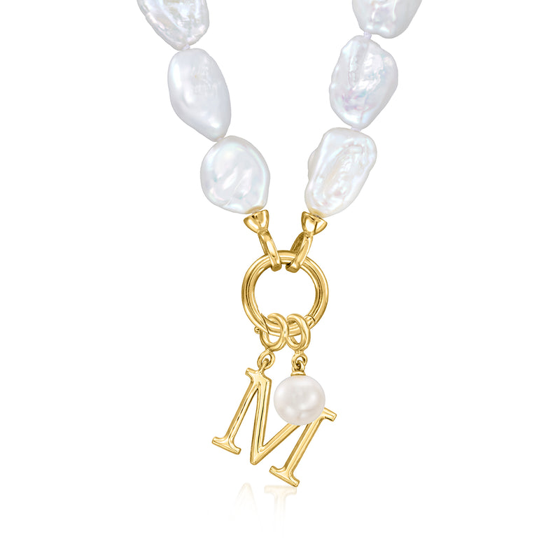 Baroque pearl necklace featuring a gold N charm with a white pearl drop