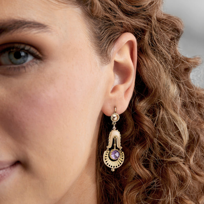 Gold earwire drop earrings with round amethyst-purple center and ornate arch frame