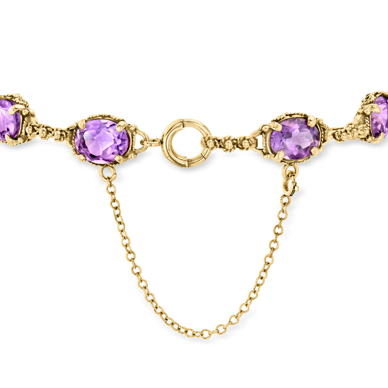 Gold amethyst link bracelet with round purple stones and center ring connector