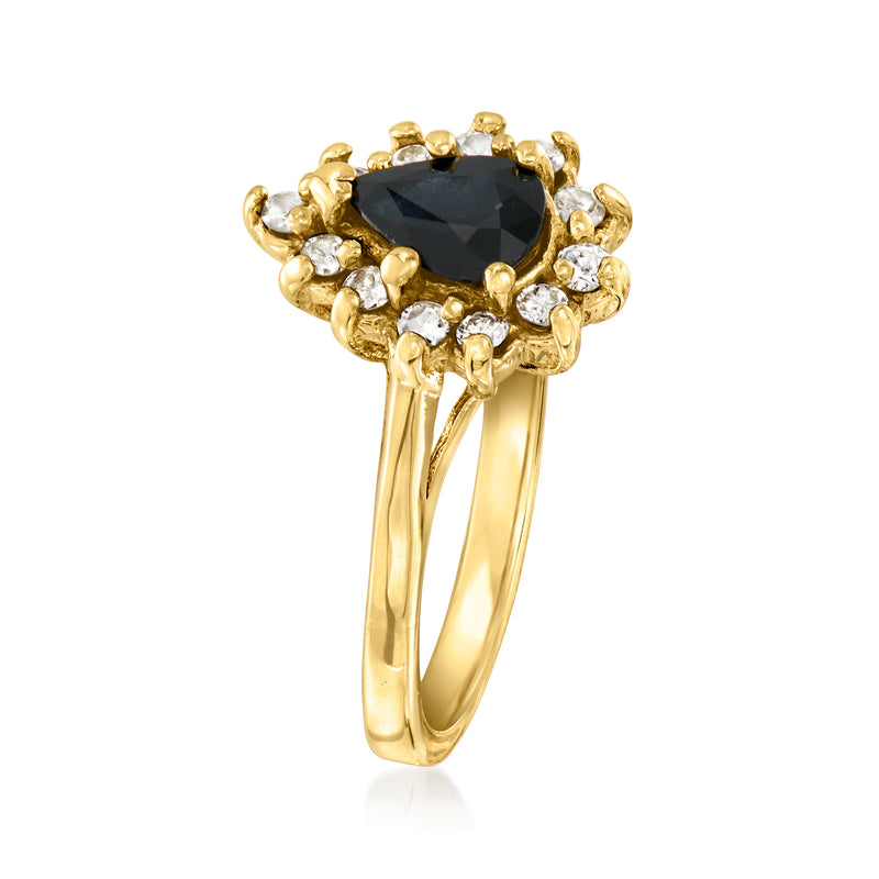 14kt yellow gold ring with dark oval center stone and diamond halo, slim band
