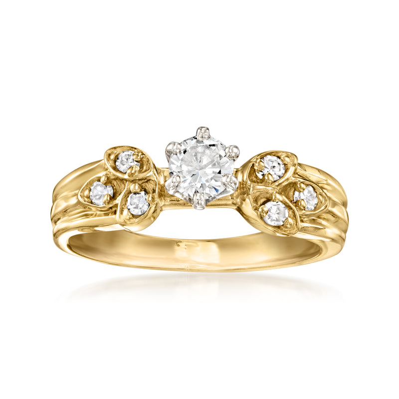 Vintage diamond ring in 14k yellow gold with a round center stone and side accents