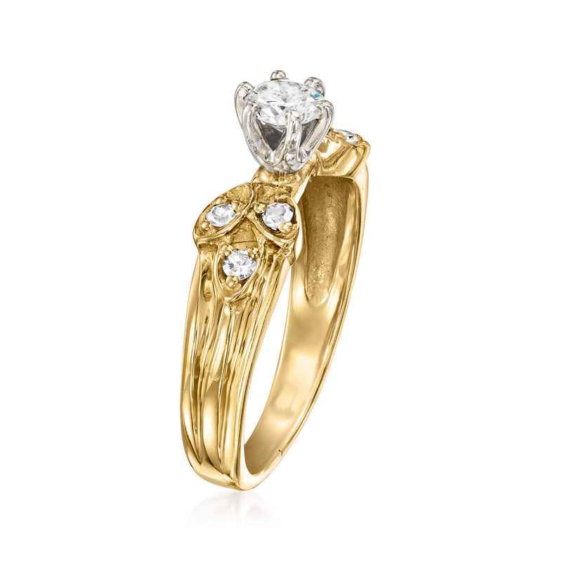 14k yellow gold vintage diamond ring with raised round center stone and clustered sides