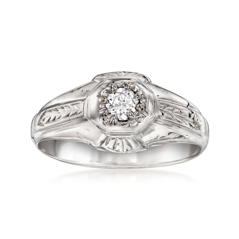 Vintage white gold diamond ring with round center stone and ornate leaf band