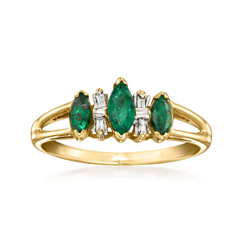 14kt yellow gold ring with three emerald-cut green stones and baguette diamonds