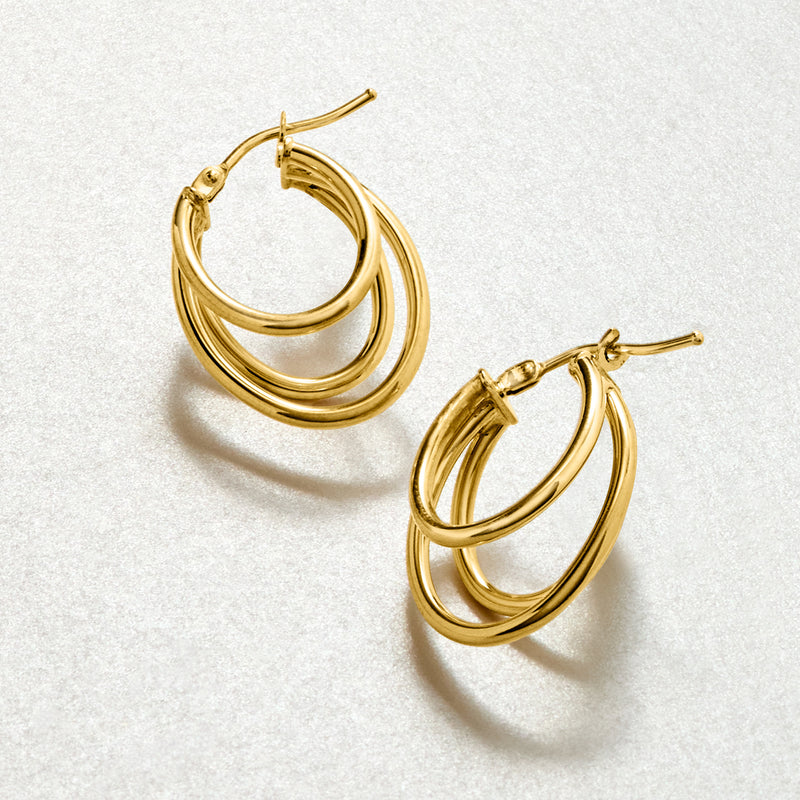 Triple-oval yellow gold hoop earrings with stacked oval loops, hinged post