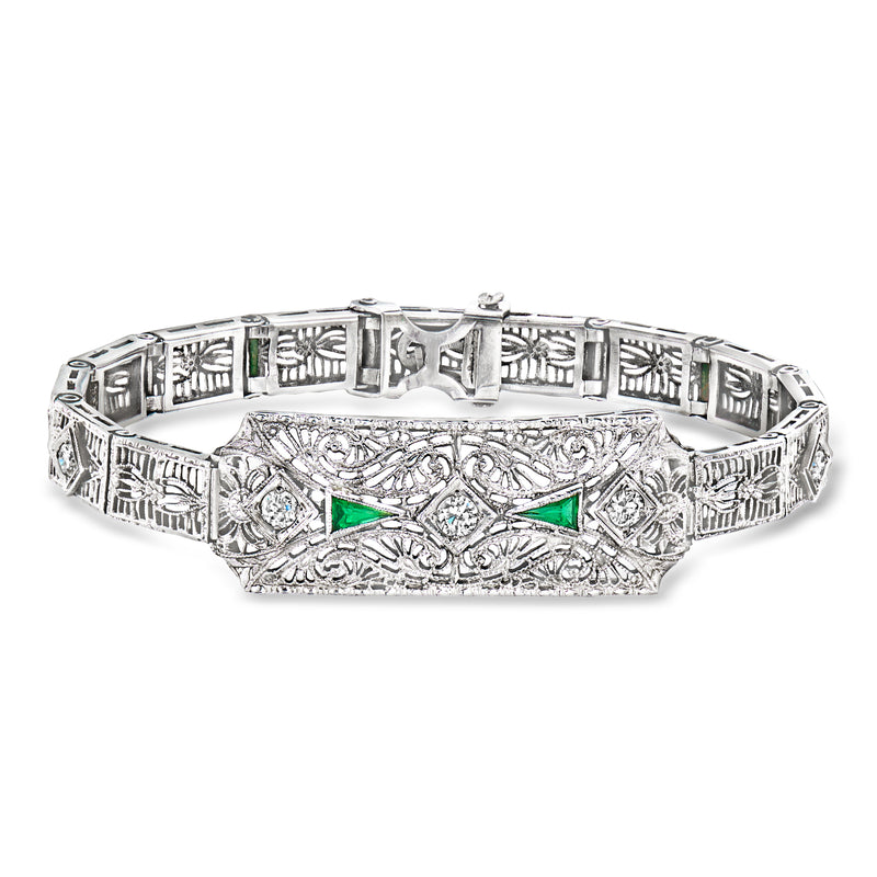 Vintage white gold filigree bracelet with green stones and diamond-like accents