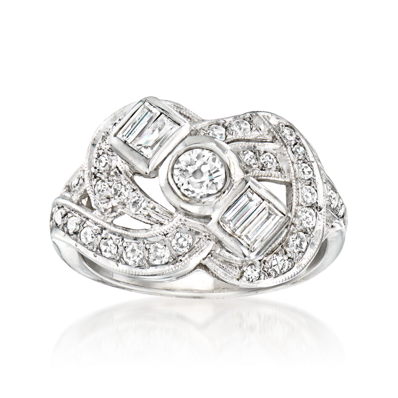 Vintage white gold diamond cocktail ring with round center and baguette side stones