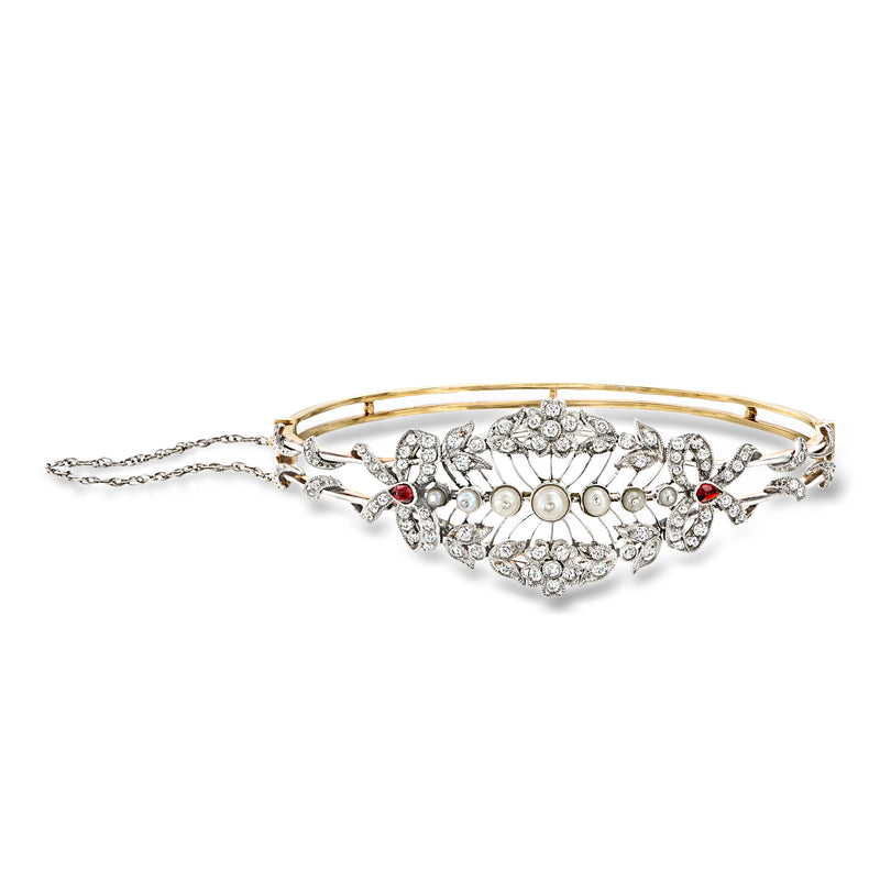 Vintage openwork bangle bracelet with cultured pearls, diamonds, and red garnets in gold