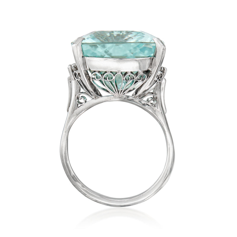 Platinum ring view from behind: aquamarine set in openwork gallery with decorative scrolls