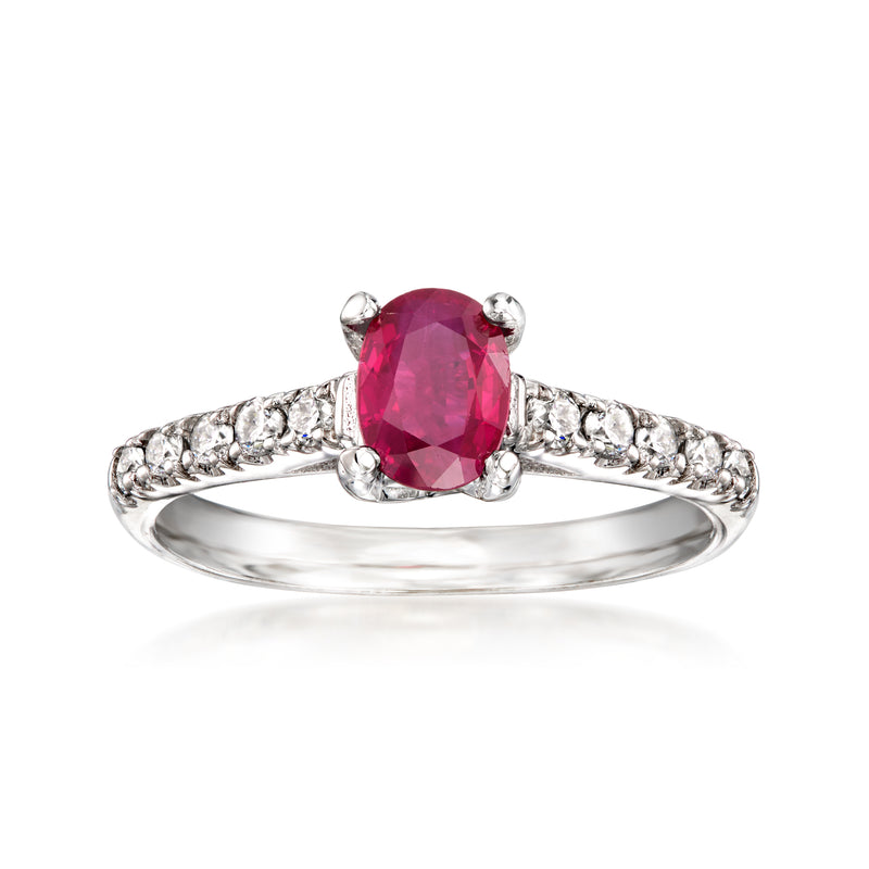 Ruby and diamond oval cluster ring in 18kt white gold, prong-set pink center stone