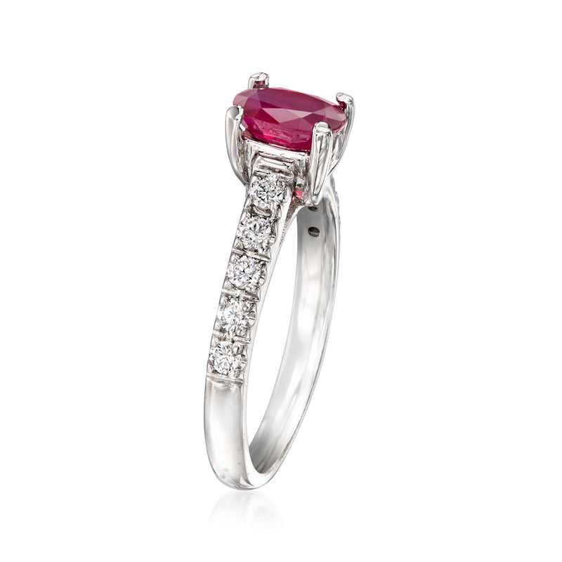 18kt white gold ring with prong-set pink ruby center and diamond side accents