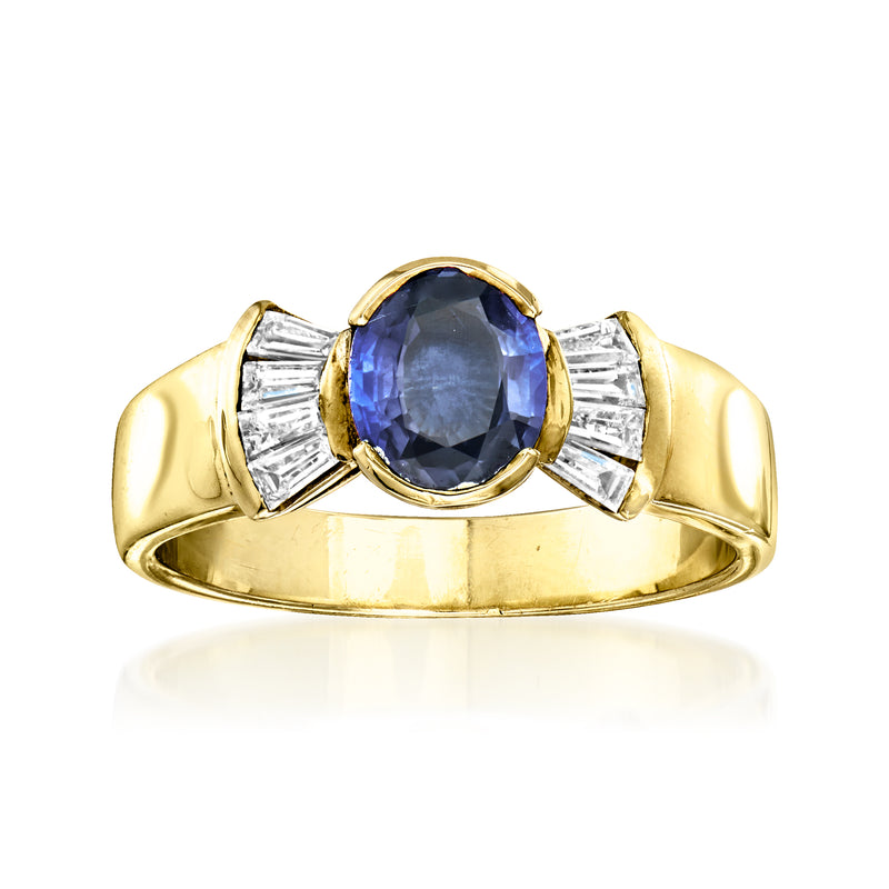 Yellow gold ring with oval blue sapphire and baguette diamond shoulders