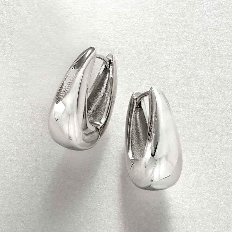 Silver-plated oval hoop earrings with high-shine curved profile, hinged back