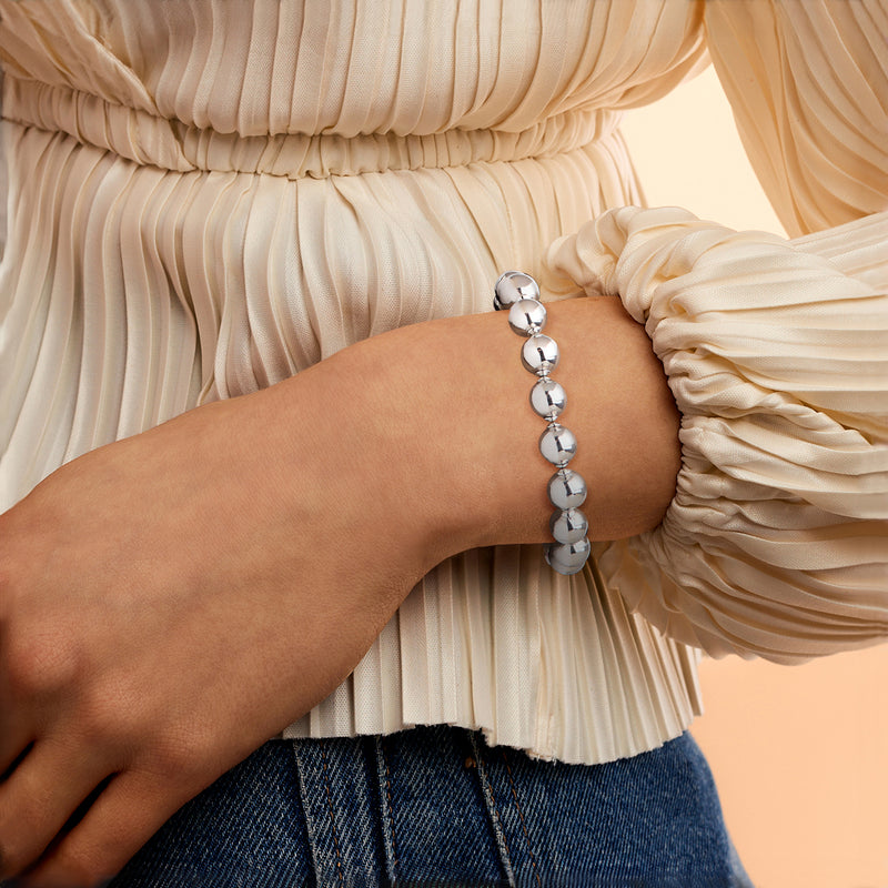 Silver-plated bead bracelet on wrist with round ball beads