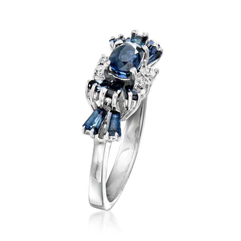 Sapphire and diamond bow ring in white gold, oval blue center with prong-set side stones