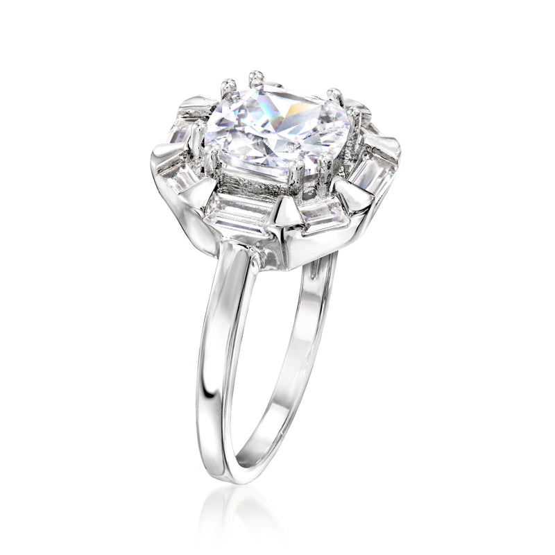 Silver-plated ring with square CZ center, prong-set baguette side stones, angled.