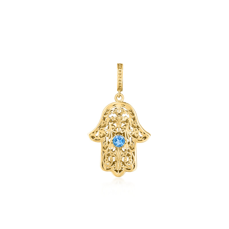 Hamsa charm pendant in gold-tone filigree with blue topaz-style center stone
