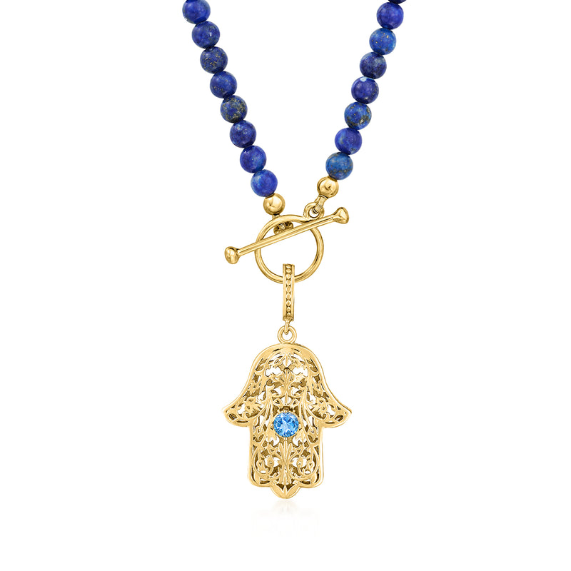 Gold-tone clasp and blue bead strand with dangling hamsa charm and blue center stone