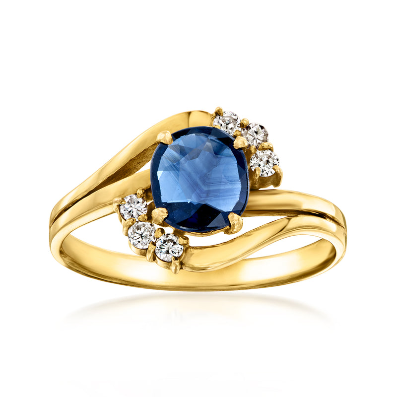 14kt yellow gold ring with oval blue sapphire and round diamond halo
