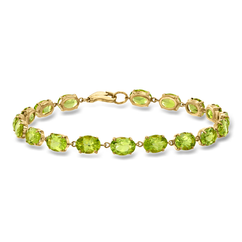 Vintage peridot gemstone tennis bracelet with oval green stones in yellow gold